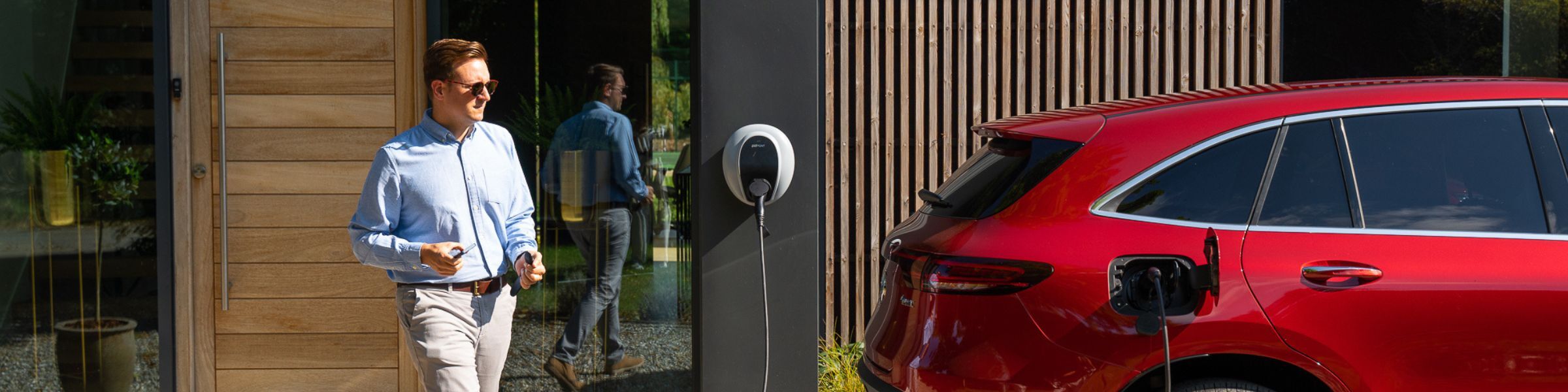 Man approaching Mercedes-Benz charging station