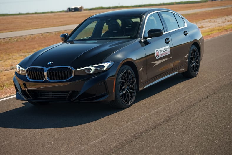 BMW sedan on oval track