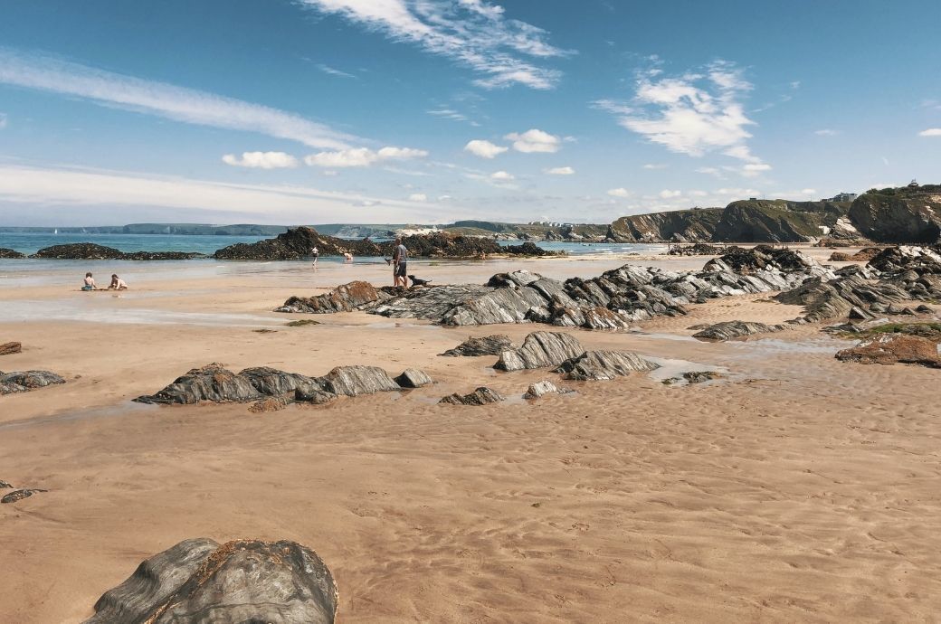 Rocky beach with beachgoers