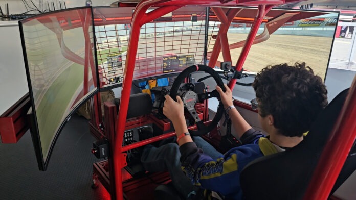 Person using dirt racing simulator