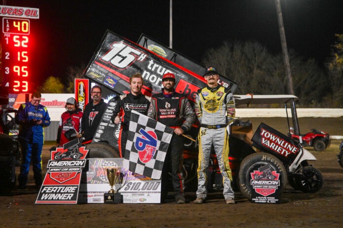 Race winners at dirt track podium