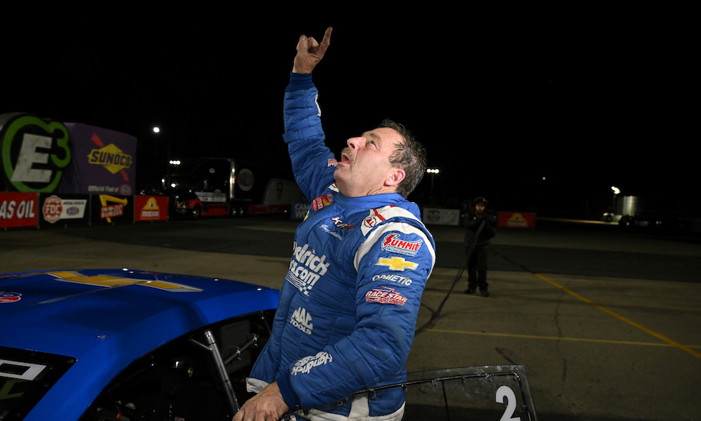 Racing driver in blue uniform