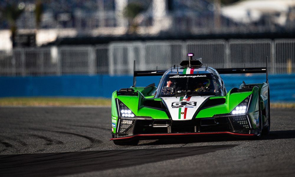 Green race car testing at Daytona