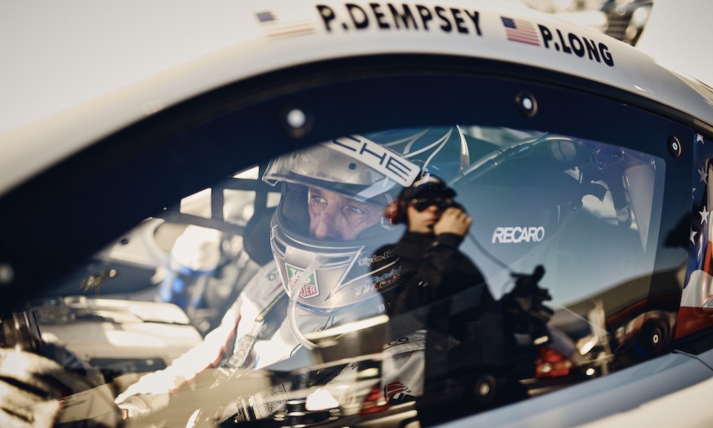 Race driver wearing crash helmet