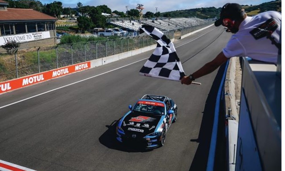 Checkered flag waves at finish line