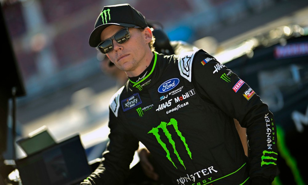 Driver wearing Monster Energy racing jacket