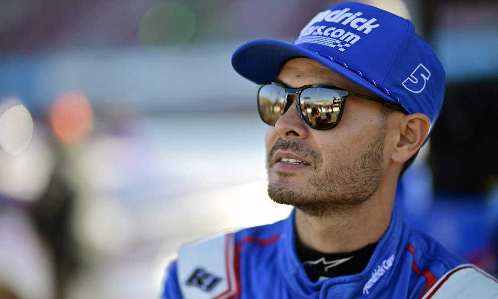 Man wearing blue NASCAR hat trackside