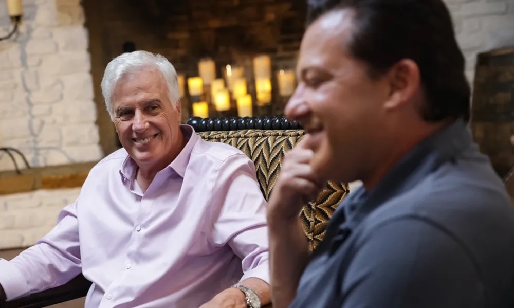 Two men at roundtable discussion