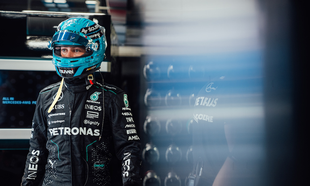 Racing driver Lewis Hamilton in Mercedes suit