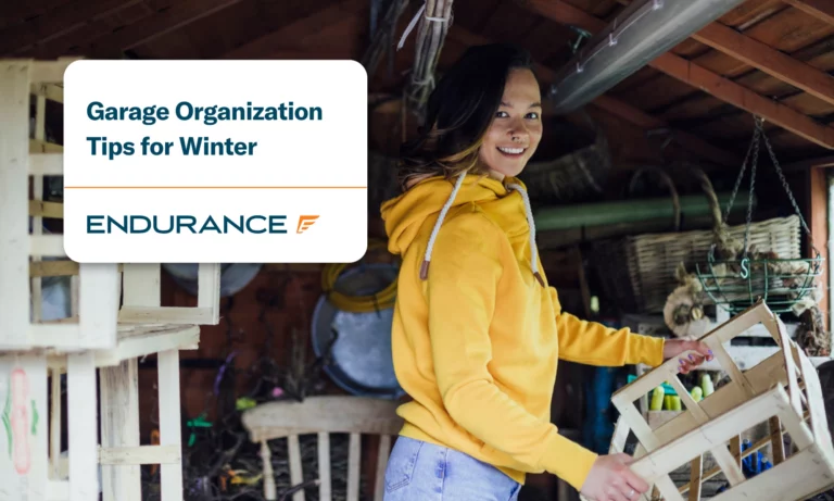 Woman organizing winter items in garage