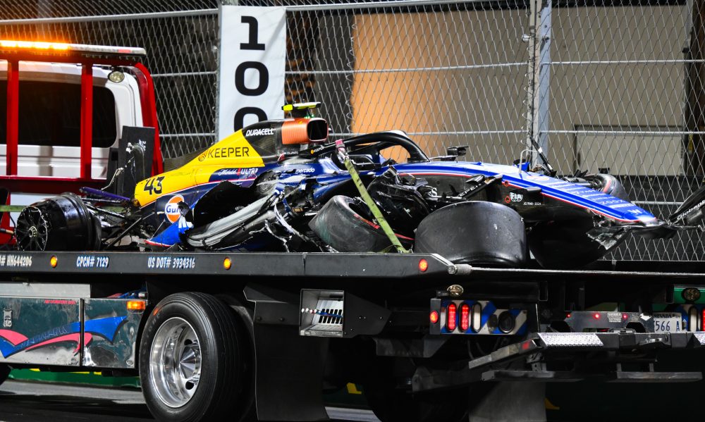 Damaged race car on tow truck