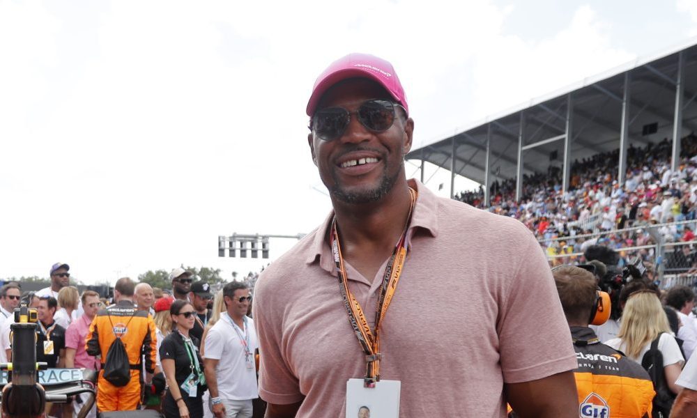 Man wearing pink baseball cap