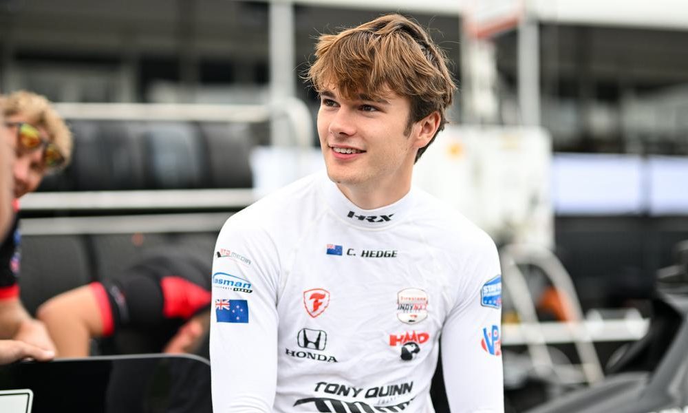 Callum Hedge smiles at race event