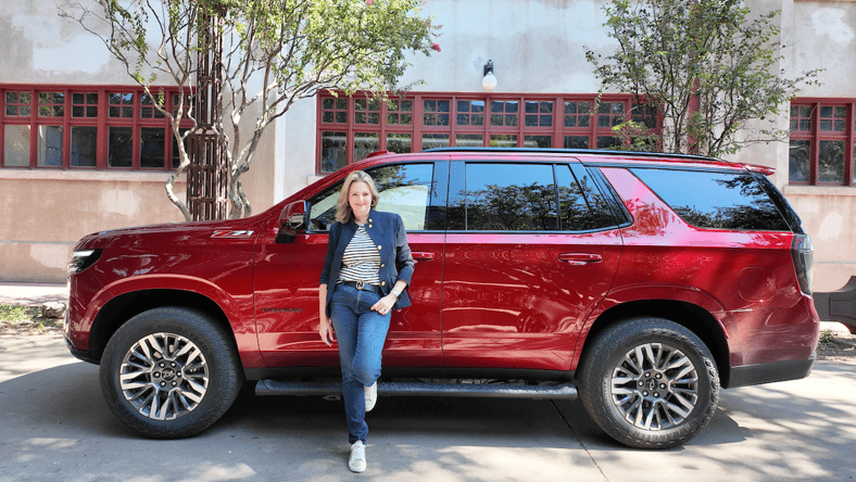 Woman beside 2025 Chevrolet Tahoe