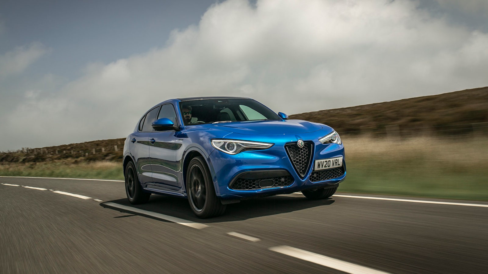 Blue Alfa Romeo Stelvio on road