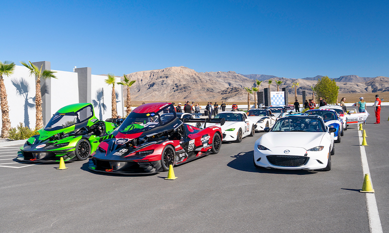 Race cars lined up against mountains