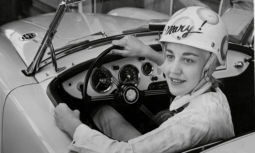 Mary McGee in vintage sports car