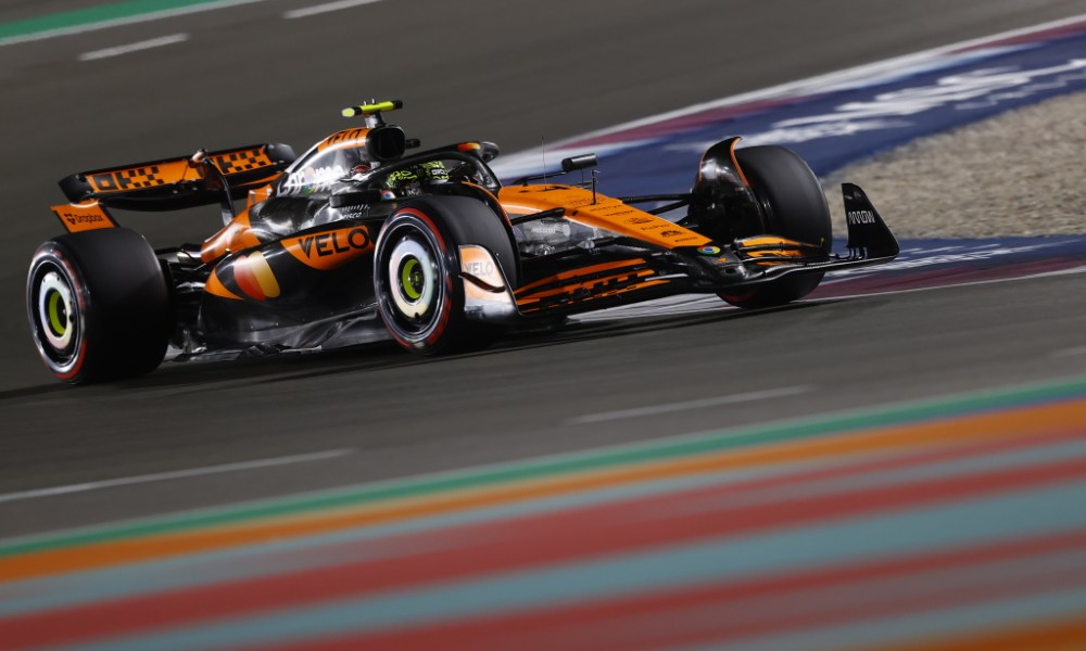 Orange McLaren F1 car on track