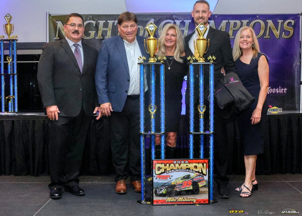 Race winners with championship trophies