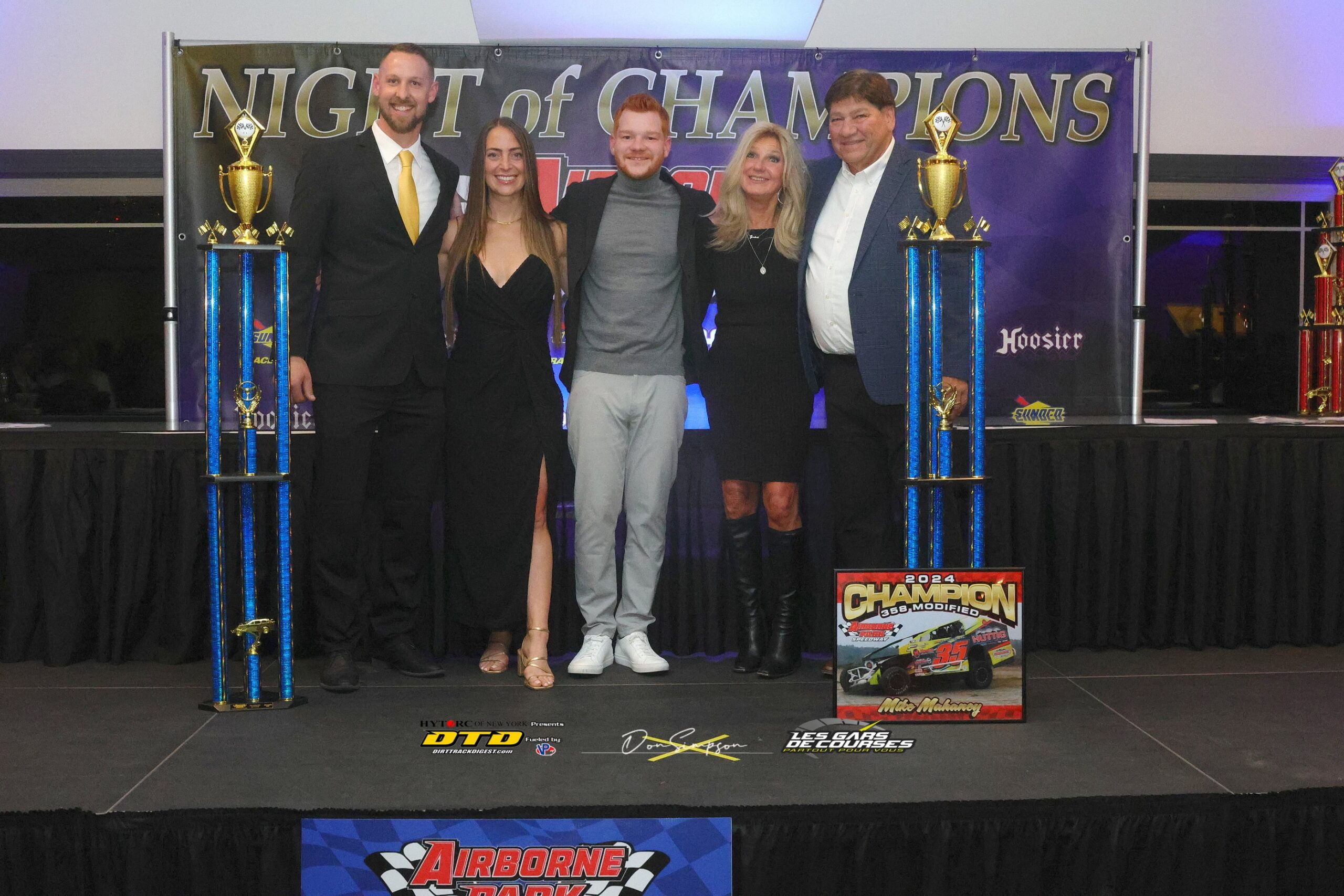 Award winners celebrate on racing stage