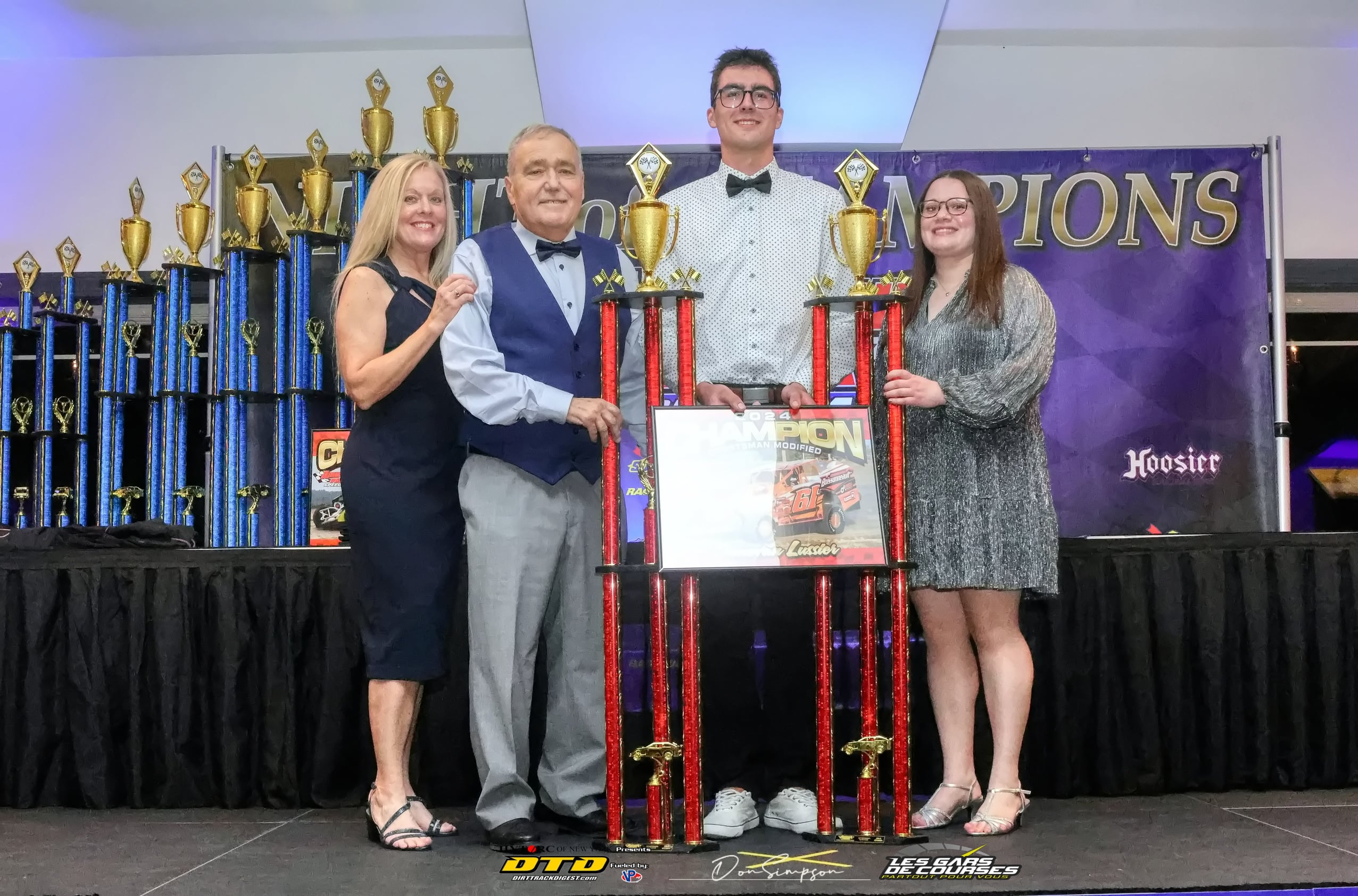 Winners display racing trophies