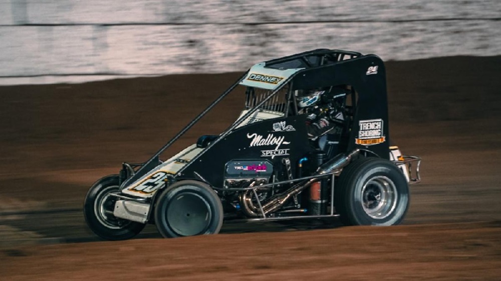 Sprint car racing on dirt track