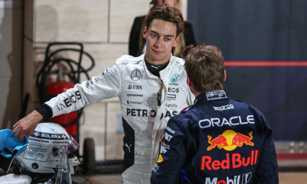 Two F1 drivers talking trackside