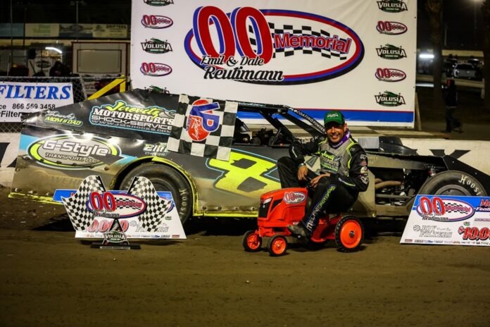 Man driving tractor on dirt track