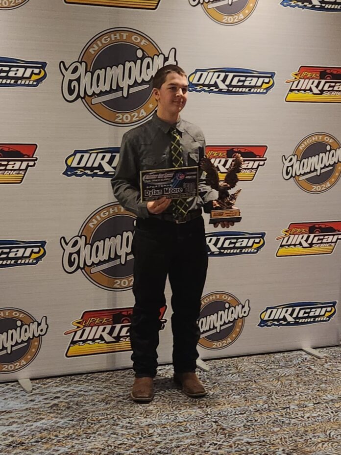 Man holds racing trophy