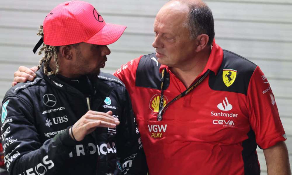 Two race car drivers in uniforms