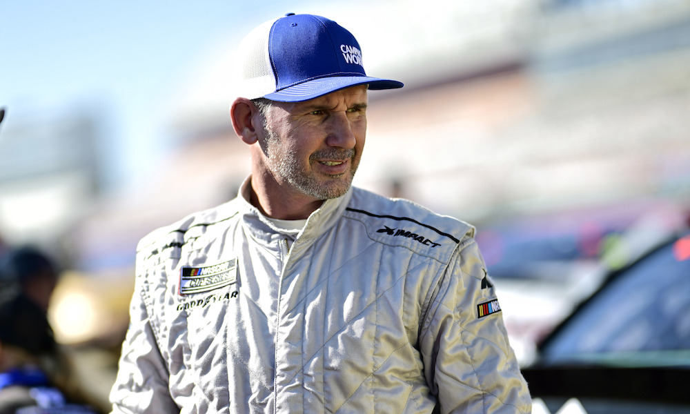 Racing driver in white suit