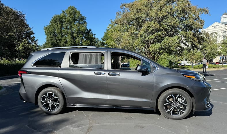 Silver Toyota Sienna minivan profile view