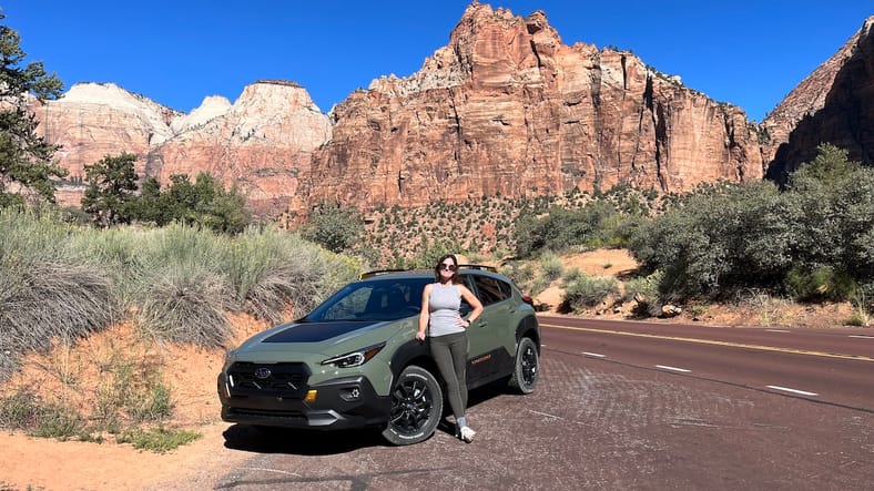 Woman beside Subaru Crosstrek Wilderness