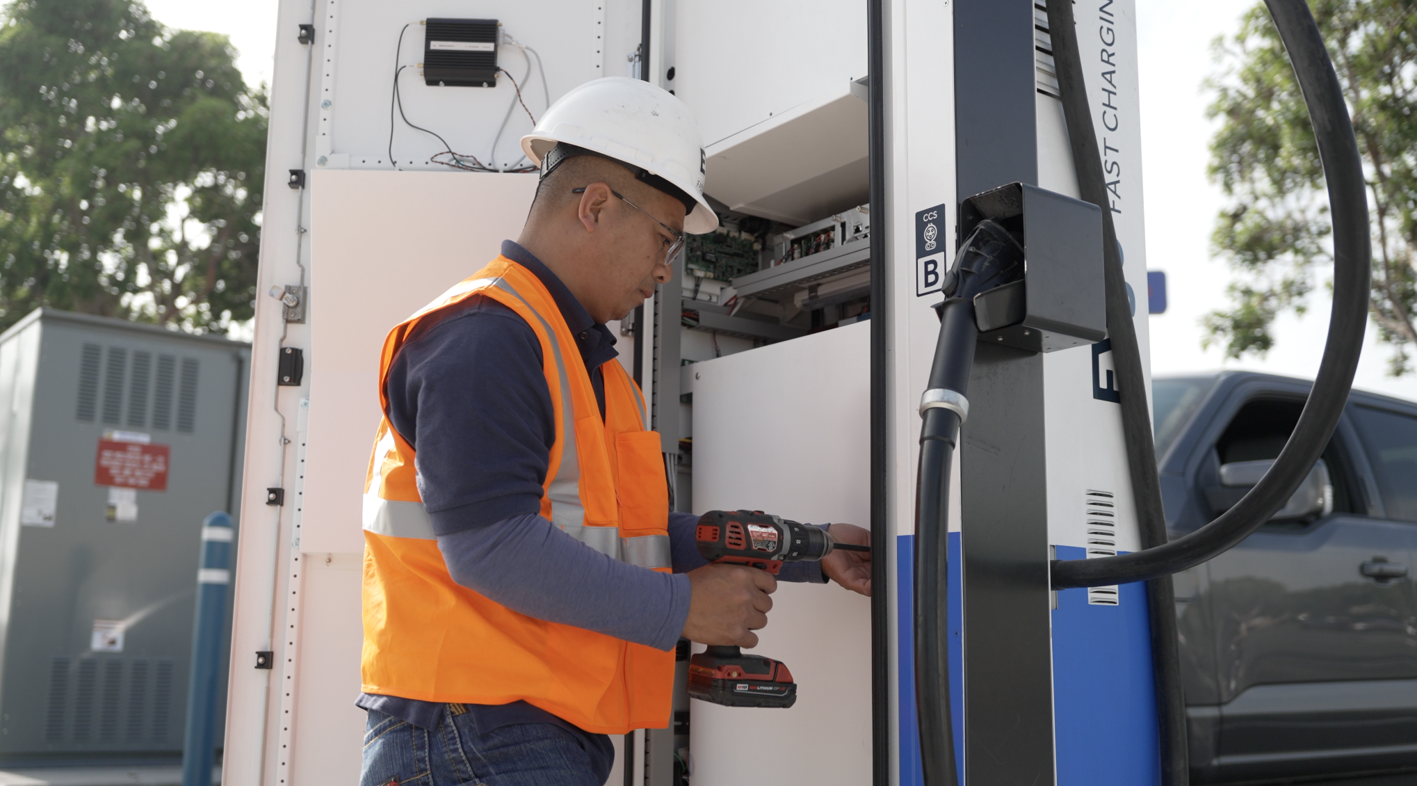 EVGo technician servicing charging station