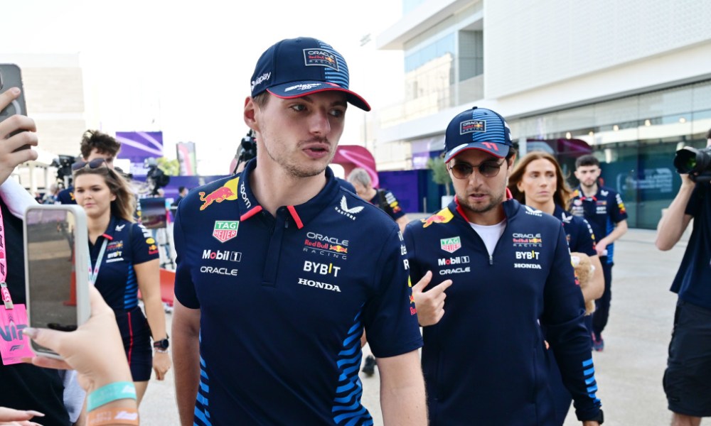 Two racers in navy uniforms