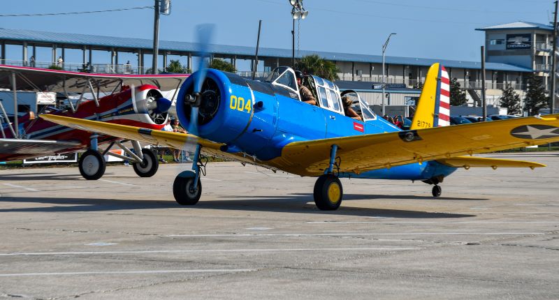 Two planes parked on tarmac