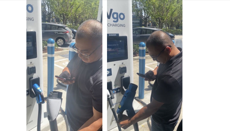 Two technicians at EV charging station