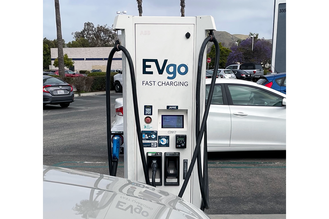 EVgo charging station with person