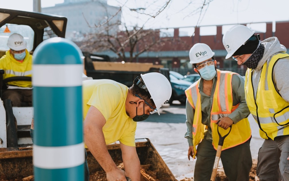 Three workers wearing hard hats