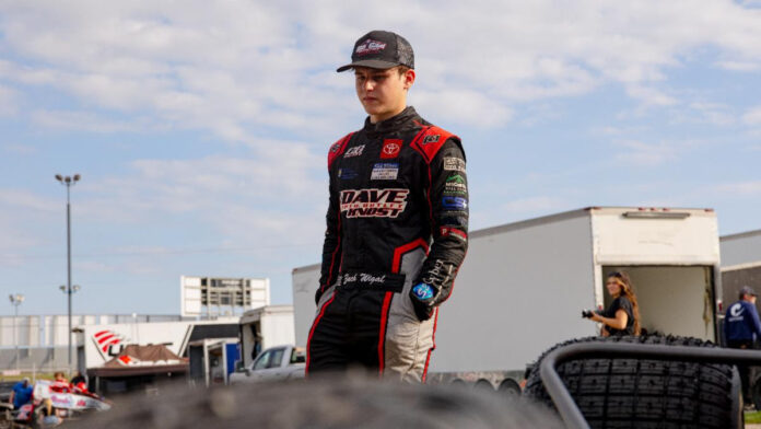 Race car driver in black suit