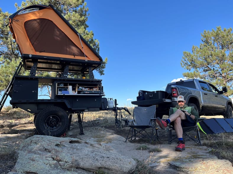 Ram 1500 beside travel trailer