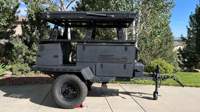 Black trailer parked in driveway