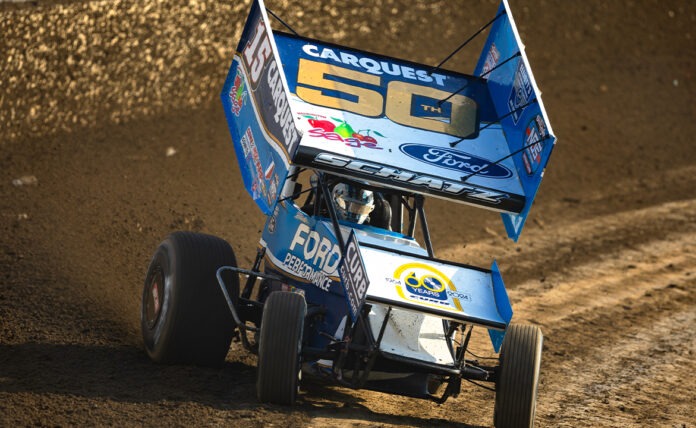 Sprint car racing on dirt track