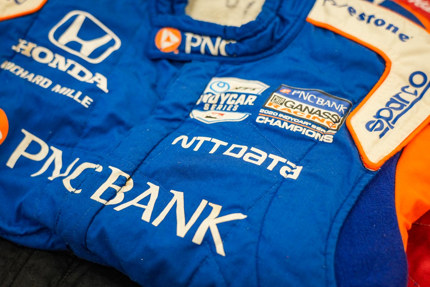 Racing driver's blue-orange uniform