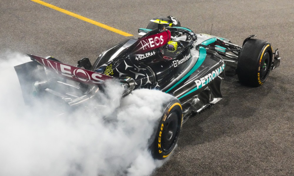 Race car drifting through tire smoke