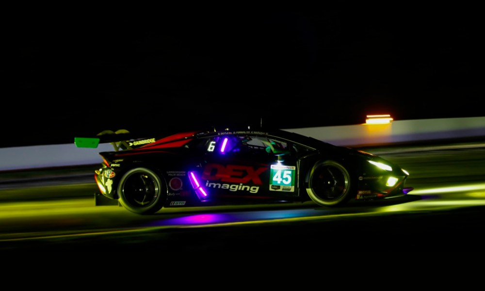 IMSA race car races at night