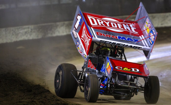 Sprint car racing on dirt track