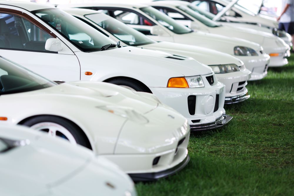 Row of white Porsche race cars