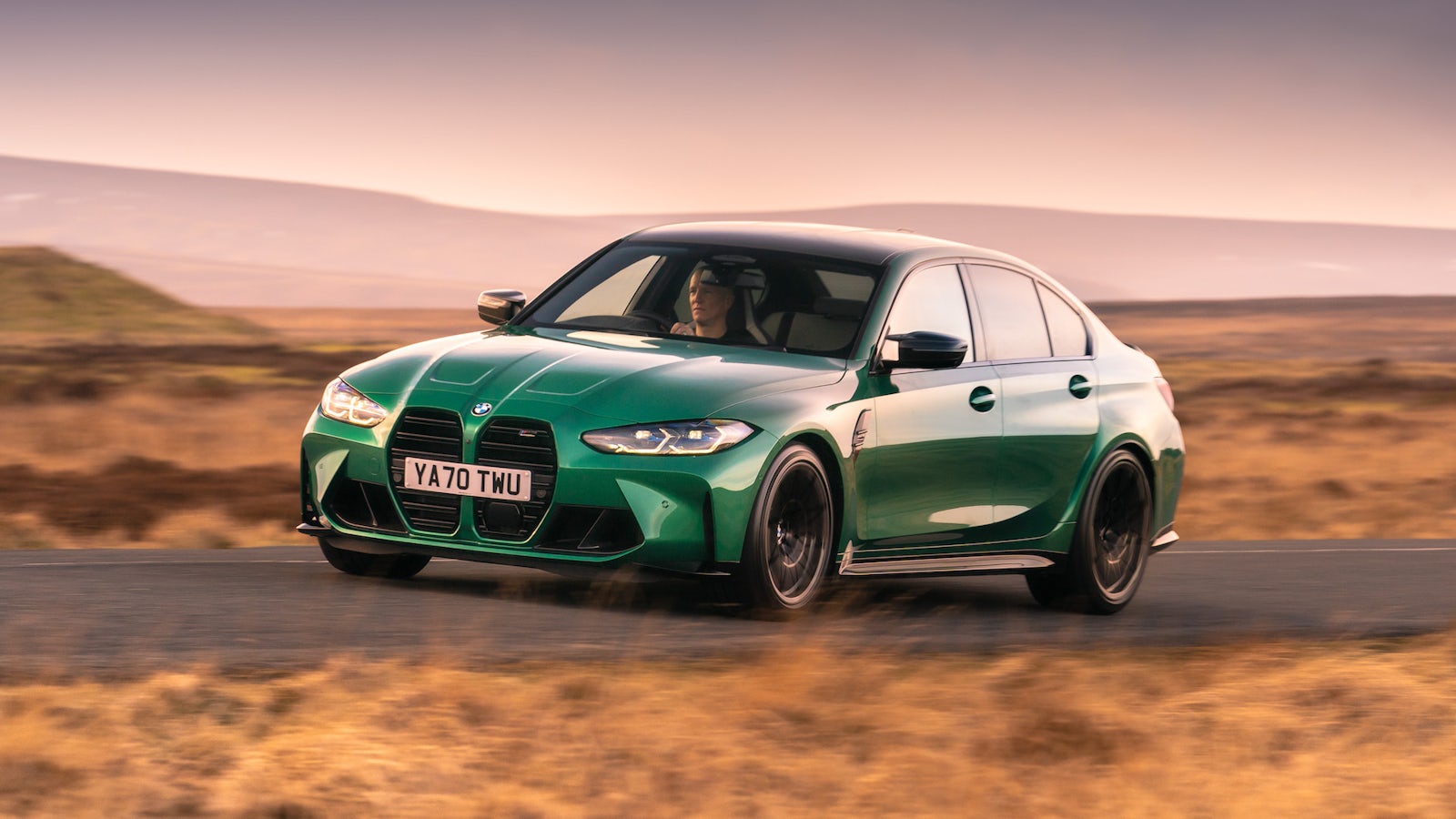 Green BMW M3 on road