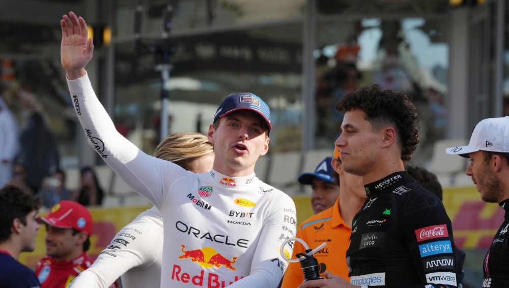 Racing driver waving at camera